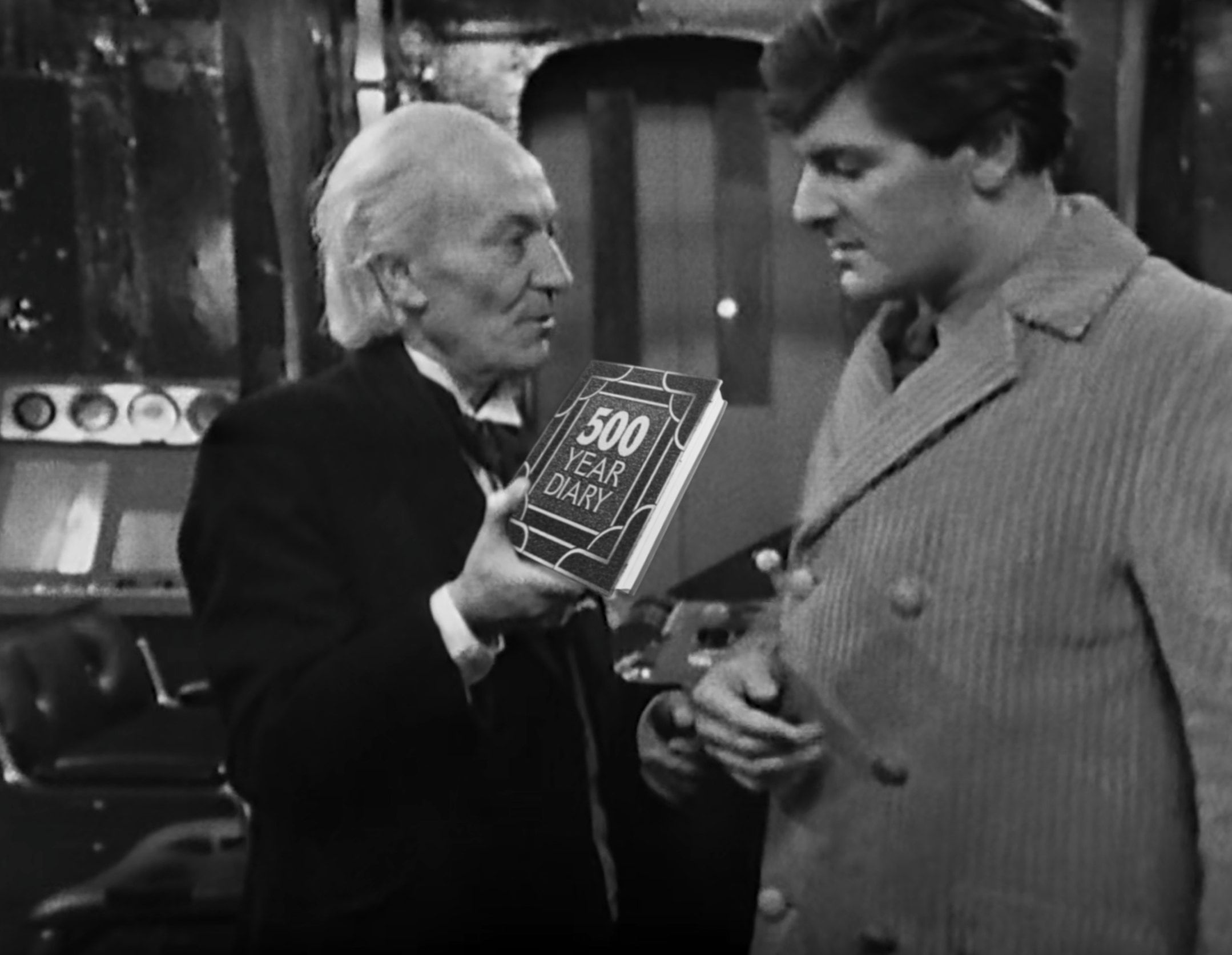In a screenshot from the newly-recovered episode 3 of The Daleks' Master Plan, The Doctor and Steven are standing on the flight deck of the Spar. The Doctor hands Steven an object, which might have originally been the taranium core of the Time Destructor, but which now seems to be his 500 Year Diary, with the podcast logo on the cover.