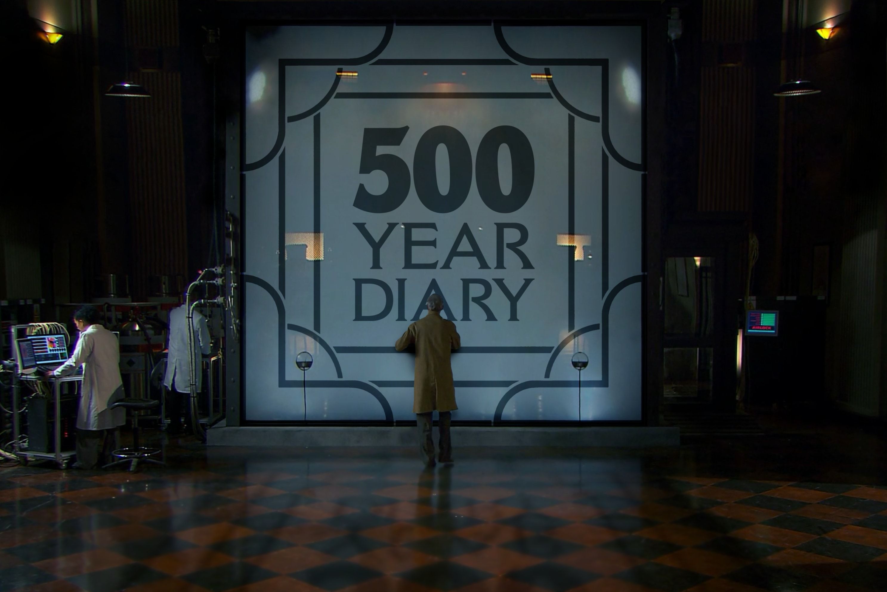 The tank for the 456 on Floor 13 of Thames House. It's huge, flanked by computer screens and white coated technicians. The inside is glowing blue. A man in a fawn coat is pressed up against the glass, peering into the smoke. The glass of the tank is stylishly frosted with the 500 Year Diary logo.